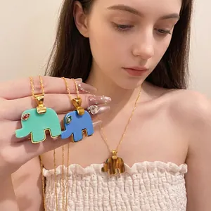 Bohemian resin elephant pendant necklace with rhinestone accents and gold water wave chain