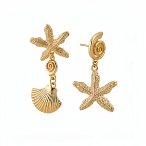 Elegant gold asymmetric starfish and shell drop earrings with pavé-set crystals
