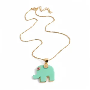 Bohemian mint green resin elephant pendant necklace with gold chain and red stone