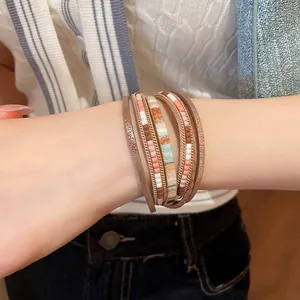 Close-up of bohemian multilayer leather woven bracelet with magnetic clasp on wrist