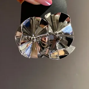 Minimalist silver pleated fan-shaped earrings with high-polish metallic finish