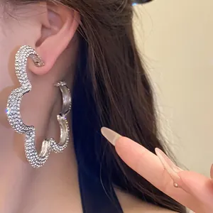 Oversized silver flower hoop earrings with glittering rhinestones for elegant women