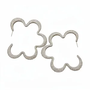 Elegant silver-toned hollow flower hoop earrings fully pavé-set with sparkling crystals