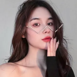 Fashionable W-shaped metal glasses frame with rhinestones worn by an Asian model