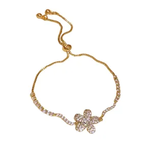 Elegant gold bracelet with sparkling zircon flower pendant and adjustable slider clasp