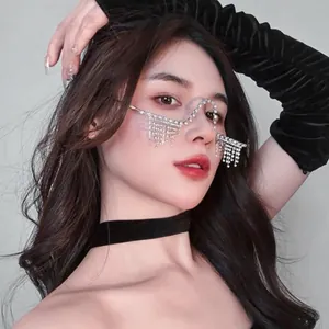 Close-up detail of a model wearing a silver W-shape rhinestone tassel lensless frame