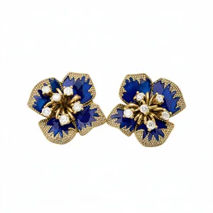Vintage-style royal blue flower stud earrings with gold accents and sparkling crystals