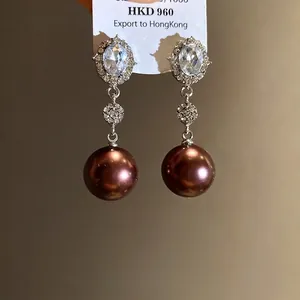 Elegant silver needle oval crystal drop earrings with large brown pearls for women