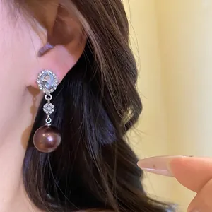 Elegant silver oval rhinestone earrings with dark pearl drops and flower detail