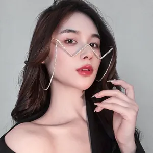 Close-up of W-shaped rimless glasses with rhinestones and tassels on female model