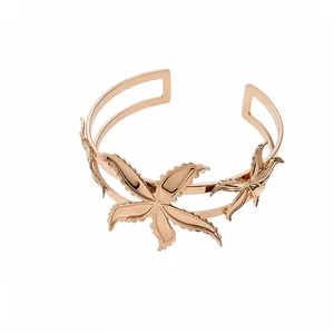 Elegante brazalete vintage de oro rosa con motivo de estrella de mar y hojas caladas finas