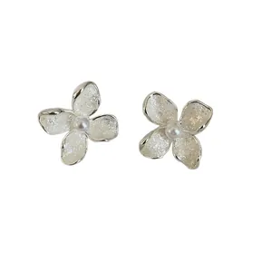 Elegant French style flower stud earrings featuring white pearl centers and silver pins