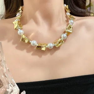 Detailed view of elegant vintage pearl necklace with irregular gold metal beads