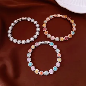 Detailed view of three elegant round zircon bracelets in silver and rose gold.