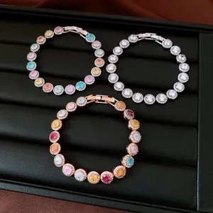 Detail view of three elegant round cubic zirconia bracelets in silver and rose gold