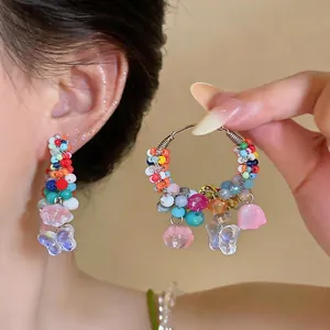 Vibrant dopamine style colorful beaded hoop earrings with butterfly charms for summer