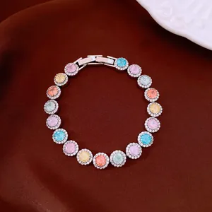 Detailed view of gold-plated zircon bracelet with vibrant multi-colored round stones