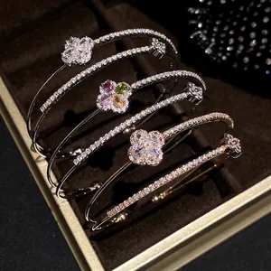 Elegant 18k gold plated double-layer bangles with zircon flower motifs in a luxury box