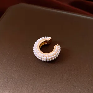 Elegant French-style pearl-encrusted ear cuff jewelry with luxury gold-tone finish
