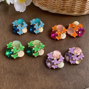 Vibrant colorful butterfly stud earrings with rhinestones and sweet enamel floral design