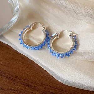 Elegant Korean style silver hoop earrings adorned with radiant blue faceted glass beads