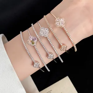 Detailed view of 18k gold plated double-layer clover bracelets with sparkling zircons.