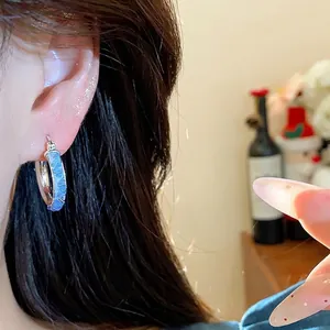 Elegant minimalist silver-tone hoop earrings with textured blue glass inlay for women