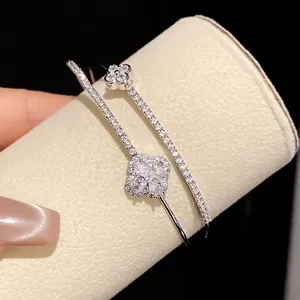 Detail shot of a double-layer bracelet featuring sparkling pavé-set flower motifs.
