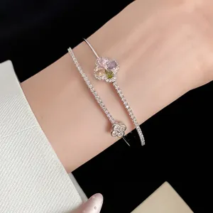 Detailed view of 18k gold-plated double-layer bangle with colorful zircon flower