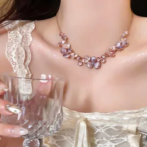 Elegant French style floral necklace with purple gradient petals on a gold chain