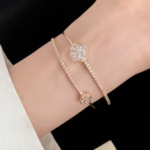 Detailed macro view of 18k gold plated double layer bracelet with zircon flowers