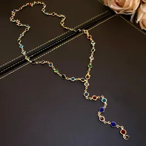 Retro court style Y-shaped necklace featuring colorful glass beads and gold-tone chain links