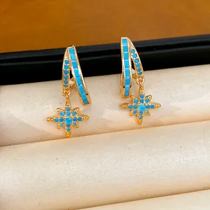 Macro detail view of double layer hoops and North Star pendant with turquoise stones