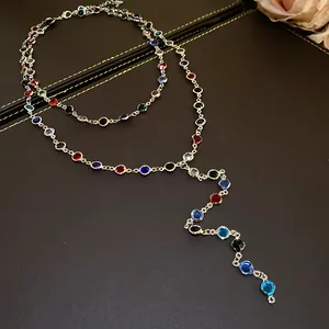 Top view of a double-layered necklace featuring vibrant colorful acrylic glass beads.