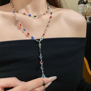 Close-up of retro double-layer necklace featuring colorful beads and a slim silver chain.