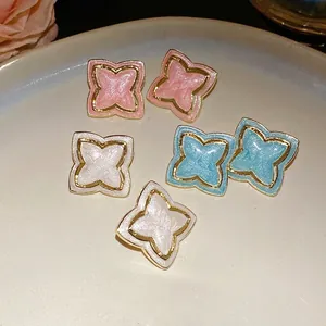 Vintage palace style enamel star flower stud earrings with gold trim and glitter detail