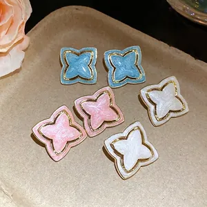 Vintage starburst flower stud earrings with shimmering enamel finish in 3 colors
