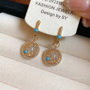 Boucles d'oreilles vintage plaquées or 18K avec zircons étoilés et turquoise bleue