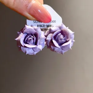 Elegant purple resin rose flower stud earrings featuring intricate petal textures and silver needles