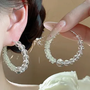 Elegant glass beaded hoop earrings with silver needles for a minimalist style