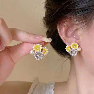 Elegant zircon flower pearl stud earrings with yellow enamel petals and silver needle backs