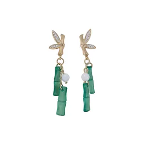 Elegant green bamboo section drop earrings with gold-plated leaf and sparkling rhinestones