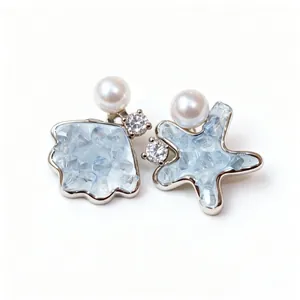 Elegant asymmetric shell and starfish stud earrings with pearls and blue zircon stones