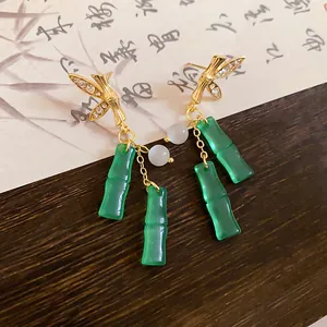 Exquisite detail of New Chinese style earrings featuring resin bamboo joints and crystals