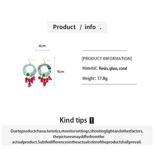 Product details for geometric flower earrings featuring resin hoops and coral dangles