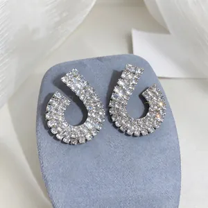 Macro view showing the sparkling crystal detail on these silver geometric stud earrings