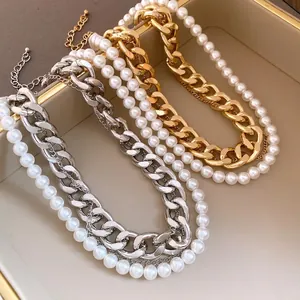 Elegant vintage multi-layer necklace with chunky metal chains and white round pearls