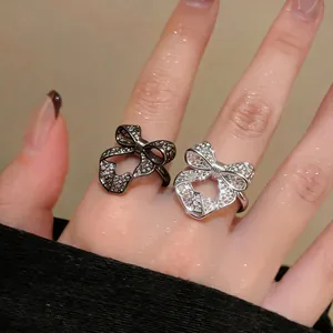 Exquisite hollow lace bow-shaped adjustable open rings in black and silver for women