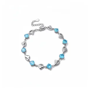 Elegant silver heart link bracelet featuring light blue circular zircons for women
