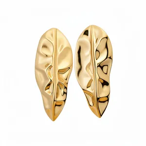Elegant golden glossy metal leaf stud earrings with a textured crumpled surface